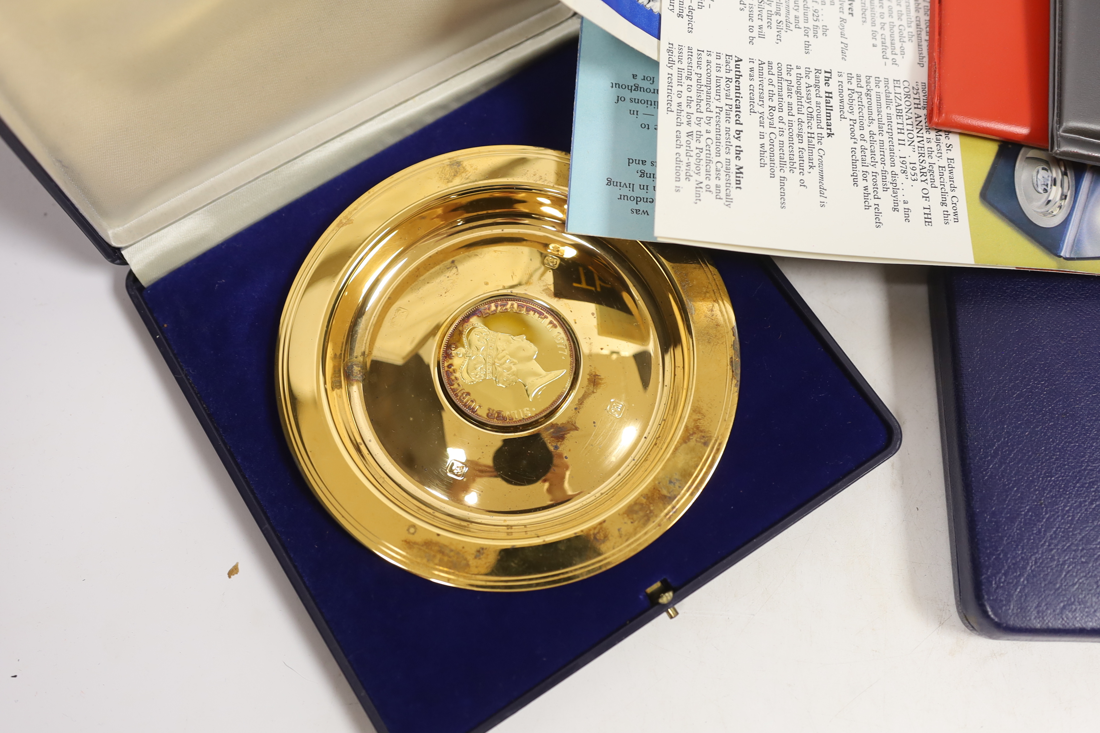 Queen Elizabeth II 1977 Silver Jubilee issues - two medallic first day covers, two cases of South Atlantic Coronation Crowns, cased Isle of Man proof silver coin set for 1977 and a silver gilt dish